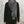 Load image into Gallery viewer, Person wearing a gray linen scarf over a black outfit against a textured wall.
