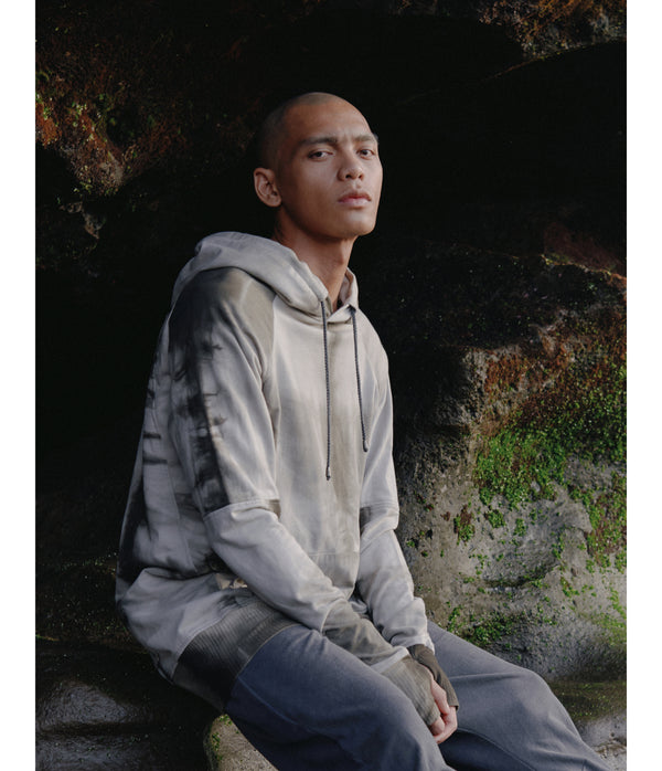 Drawstring hoodie sweatshirt crafted from medium weight cotton terry finished with ecovero* ribbing, lined hood. Hand dyed with plant with shibori method.