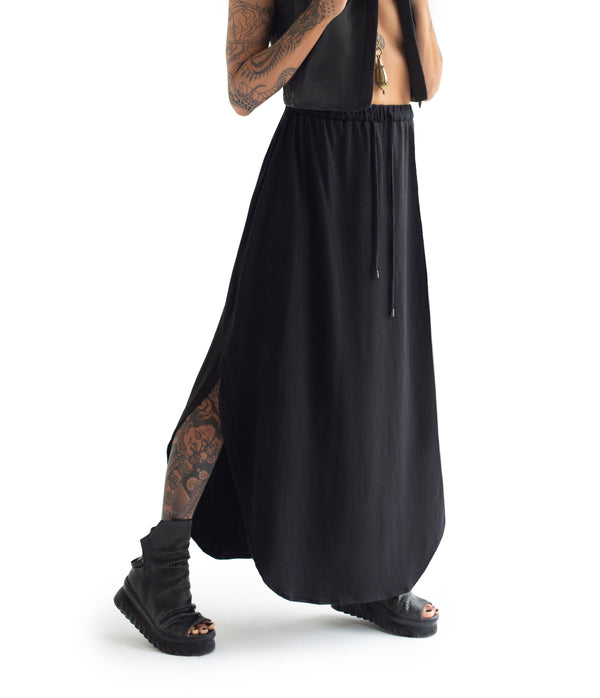  long skirt. Made of ultra soft bamboo & GOTS certified organic cotton blend.  Approx 39" from waist to ground. Made in Small Batches.  Elastic waist band with tie strings finished with custom metal caps