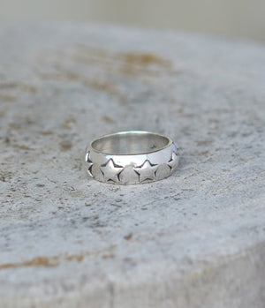 Handmade silver ring band with star detail. Can be worn by a man or a woman, unisex and minimalist.